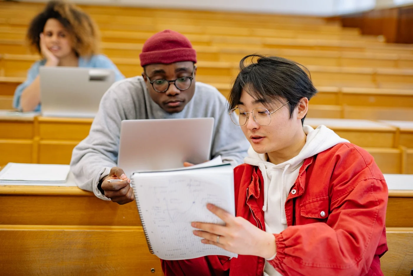 Students working together in a university lecture hall