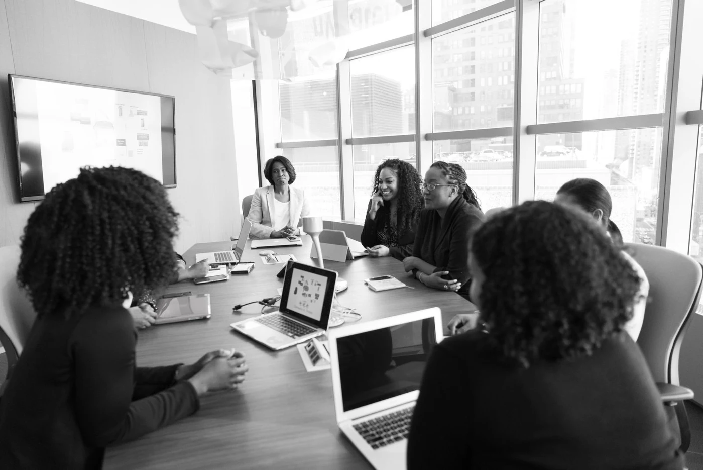 Professionals collaborating around a meeting table